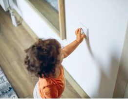 kid reaching for outlet